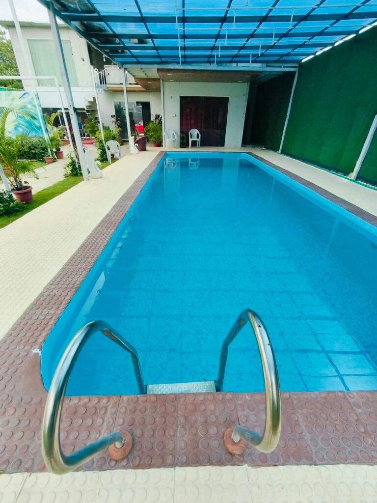 BTS Farm House Hyderabad – Beautiful Farmhouse Exterior BTS Farm House – Private Swimming Pool and Open Garden BTS Farm House – Spacious Green Outdoor Area BTS Farm House – Comfortable AC Bedroom BTS Farm House – Clean Bedroom Interior BTS Farm House – Modern Hall with Comfortable Seating BTS Farm House – Kitchen and Dining Area BTS Farm House – Private Pool for Guests BTS Farm House – Bonfire and BBQ Area BTS Farm House – Spacious Parking Area BTS Farm House – Outdoor Games and Recreation Area BTS Farm House – Peaceful Greenery Near Hyderabad BTS Farm House – Family and Friends Weekend Stay BTS Farm House – Event and Celebration Venue Near Hyderabad BTS Farm House – Farmhouse for Parties and Group Stays