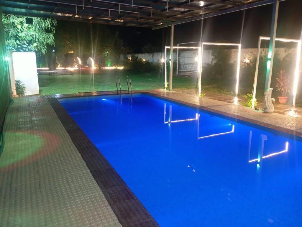 BTS Farm House Hyderabad – Beautiful Farmhouse Exterior BTS Farm House – Private Swimming Pool and Open Garden BTS Farm House – Spacious Green Outdoor Area BTS Farm House – Comfortable AC Bedroom BTS Farm House – Clean Bedroom Interior BTS Farm House – Modern Hall with Comfortable Seating BTS Farm House – Kitchen and Dining Area BTS Farm House – Private Pool for Guests BTS Farm House – Bonfire and BBQ Area BTS Farm House – Spacious Parking Area BTS Farm House – Outdoor Games and Recreation Area BTS Farm House – Peaceful Greenery Near Hyderabad BTS Farm House – Family and Friends Weekend Stay BTS Farm House – Event and Celebration Venue Near Hyderabad BTS Farm House – Farmhouse for Parties and Group Stays