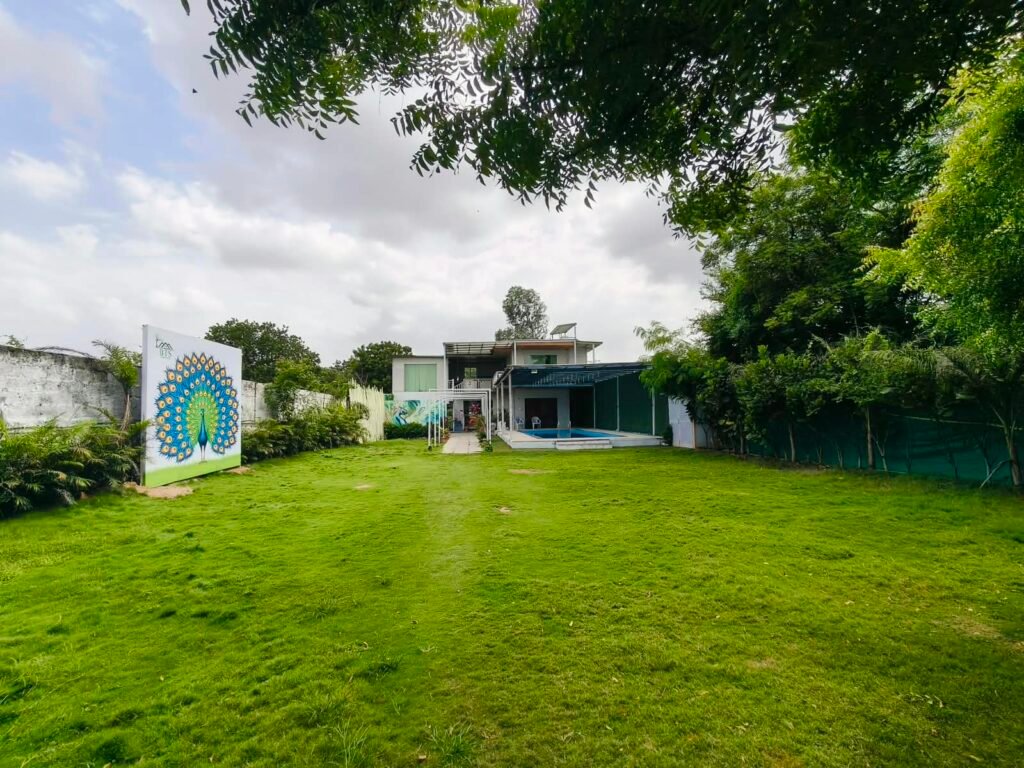 BTS Farm House Hyderabad – Beautiful Farmhouse Exterior BTS Farm House – Private Swimming Pool and Open Garden BTS Farm House – Spacious Green Outdoor Area BTS Farm House – Comfortable AC Bedroom BTS Farm House – Clean Bedroom Interior BTS Farm House – Modern Hall with Comfortable Seating BTS Farm House – Kitchen and Dining Area BTS Farm House – Private Pool for Guests BTS Farm House – Bonfire and BBQ Area BTS Farm House – Spacious Parking Area BTS Farm House – Outdoor Games and Recreation Area BTS Farm House – Peaceful Greenery Near Hyderabad BTS Farm House – Family and Friends Weekend Stay BTS Farm House – Event and Celebration Venue Near Hyderabad BTS Farm House – Farmhouse for Parties and Group Stays